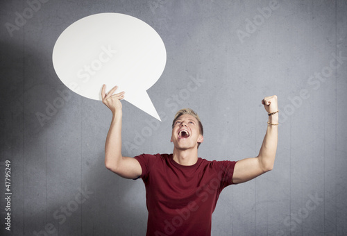 Photo: Winner holding blank speech bubble. Winner holding blank speech bubble.