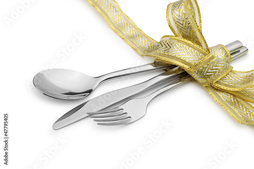 Photo: Spoon, fork and a knife tied up celebratory ribbon Spoon, fork and a knife tied up celebratory ribbon