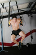 The sportsman the guy, carries out difficult exercise, sports gy