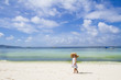 young child girl in summer hat on tropical sea background