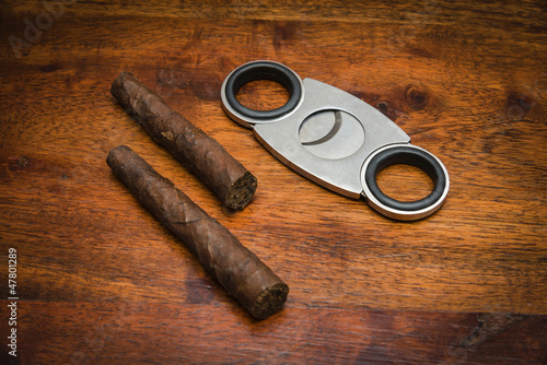 Photo: Italy, italian cigars (toscani) and a cigars cutter Italy, italian cigars (toscani) and a cigars cutter