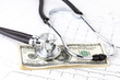 stethoscope and dollars