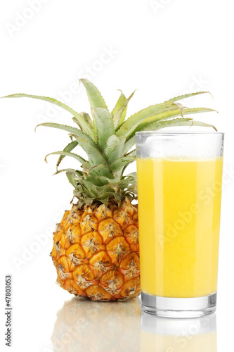 Photo: Ripe pineapple and juice glass isolated on white Ripe pineapple and juice glass isolated on white