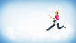 Photo: young woman playing on electro guitar and jumping young woman playing on electro guitar and jumping