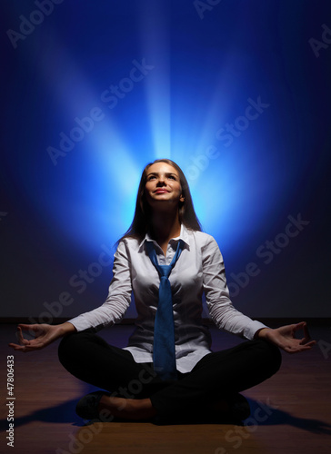 Photo: Business woman meditating Business woman meditating