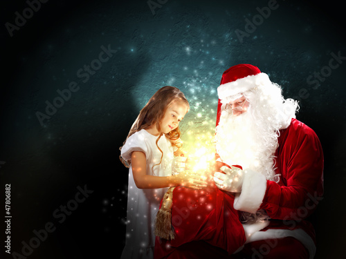 Photo: portrait of santa claus with a girl portrait of santa claus with a girl