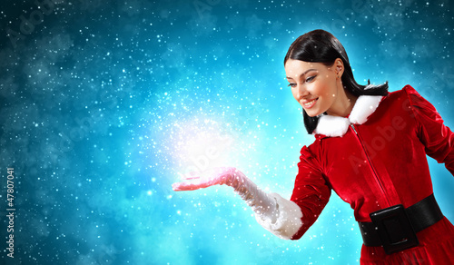 Photo: Portrait of girl wearing santa claus clothes Portrait of girl wearing santa claus clothes