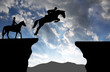 silhouette of a rider on a jumping horse
