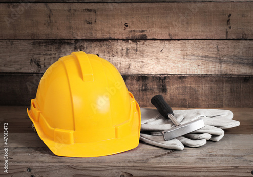 Photo: hardhat and old leather gloves hardhat and old leather gloves