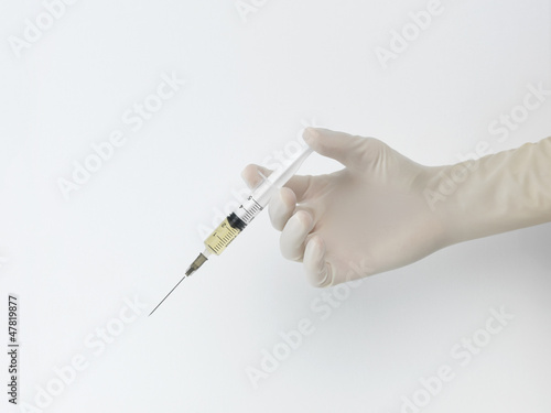 Photo: hand with syringe hand with syringe