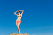 Photo: Portrait of young woman in bikini at beach Portrait of young woman in bikini at beach