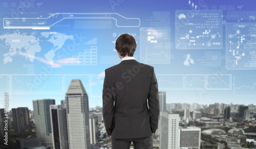 Photo: Businessman agaisnt virtual background Businessman agaisnt virtual background