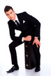 Handsome and fashionable man in a suit with bag