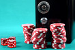 Poker gambling chips on a green playing table