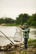 photo of little boy fishing