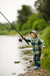 photo of little boy fishing