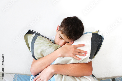 Photo: Depressed Teenager With Pillow Depressed Teenager With Pillow