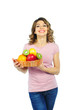 Beautiful young woman with basket of fruit