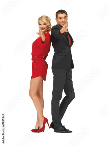 Photo: man and woman making a gun gesture man and woman making a gun gesture