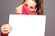 Bashful little girl with sheet of paper