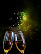 Photo: Glasses with champagne against fireworks Glasses with champagne against fireworks