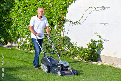 Photo: Senior man is cuting the grass 2 Senior man is cuting the grass 2