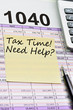 Tax forms 1040, spread sheet with pen, calculator and sticker.