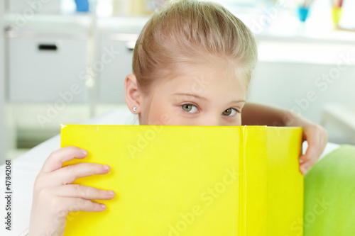 Photo: Peeking out of book Peeking out of book