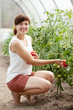 Happy  woman with tomato