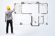 Photo: House blueprints and architect hand with drawing House blueprints and architect hand with drawing