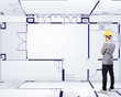 Photo: Engineering person standing near a House blueprints Engineering person standing near a House blueprints