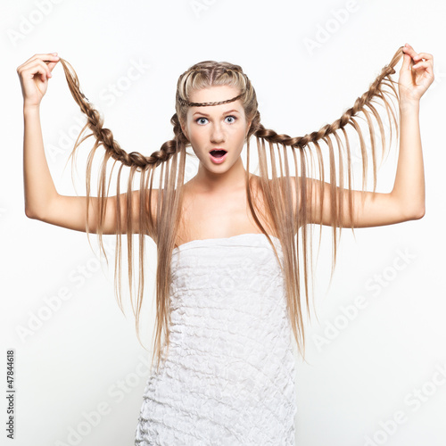 Photo: Portrait of young woman with braid hairdo Portrait of young woman with braid hairdo