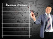 Business man writing business problem