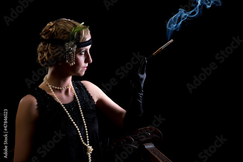 Photo: Cigarette smoker in twenties style Cigarette smoker in twenties style