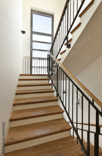 Photo: beautiful apartment, interior, wooden staircase beautiful apartment, interior, wooden staircase