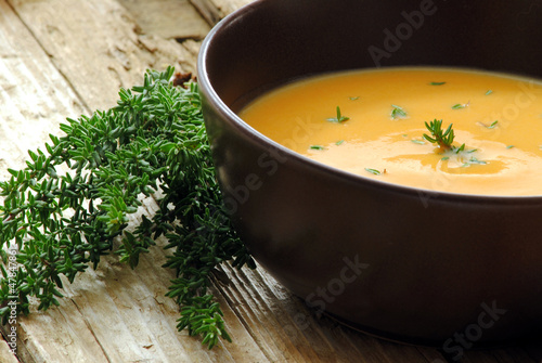 Photo: Cream soup with carrot and pumpkin decorated with thyme Cream soup with carrot and pumpkin decorated with thyme