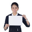Photo: Business woman in black suit holding a blank sign board Business woman in black suit holding a blank sign board