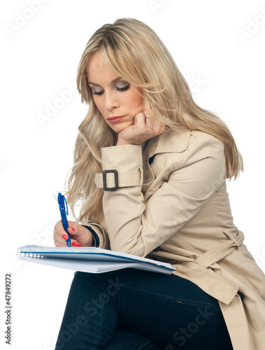 Photo: woman writing in the notebook woman writing in the notebook
