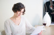 Attractive woman reading a letter