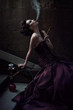Beautiful woman in violet dress