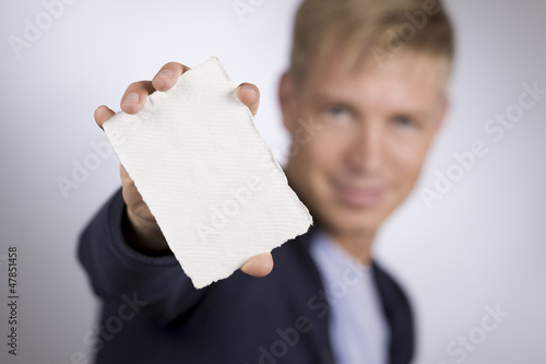 Photo: Man presenting empty white card. Man presenting empty white card.