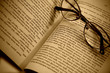 Book pages and glasses with sepia color filter