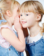Little girls sharing a secret