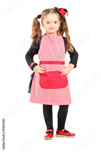 Photo: Smiling girl wearing apron and posing Smiling girl wearing apron and posing