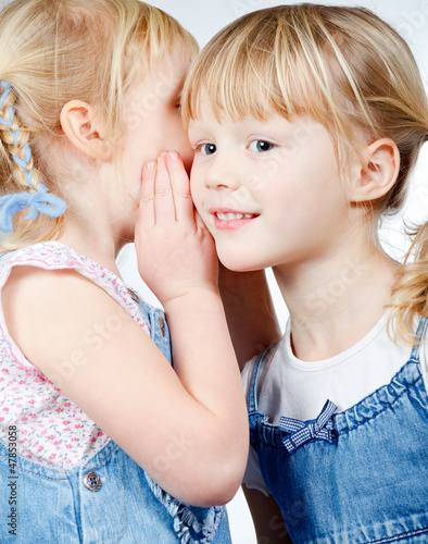 Photo: Little girls sharing a secret Little girls sharing a secret