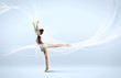Young woman in gymnast suit posing