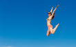 Photo: Portrait of young woman in bikini at beach Portrait of young woman in bikini at beach