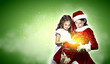 Little girl with christmas gifts and santa