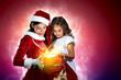 Little girl with christmas gifts and santa