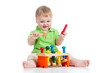 baby boy playing toy isolated on white background
